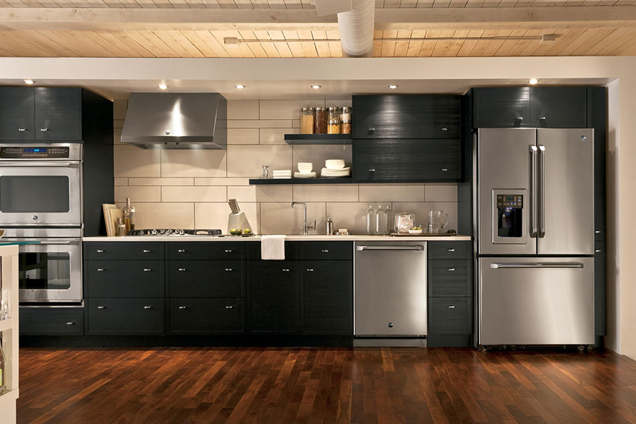 Dark brushed metal finish appliances are elegant and easy to maintain.