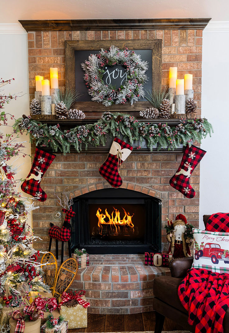 This fireplace is beautifully decorated with frosted and non-frosted pinecones, spruce, and a little bit of winterberry stems