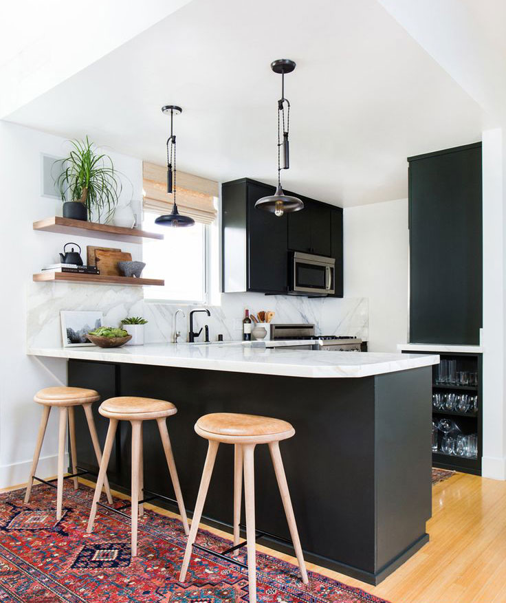 Minimalistic kitchen renovation with marble top isle